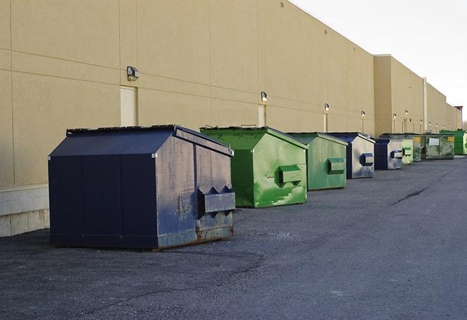 large garbage containers clustered on a construction lot in Athens MI